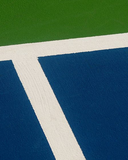 a tennis player on a court with a racket